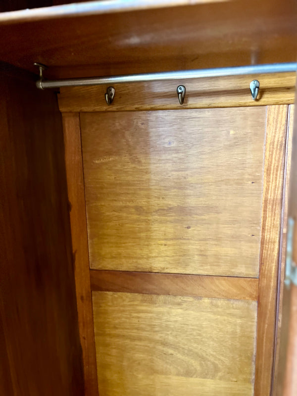 Metal hooks and rods inside armoire