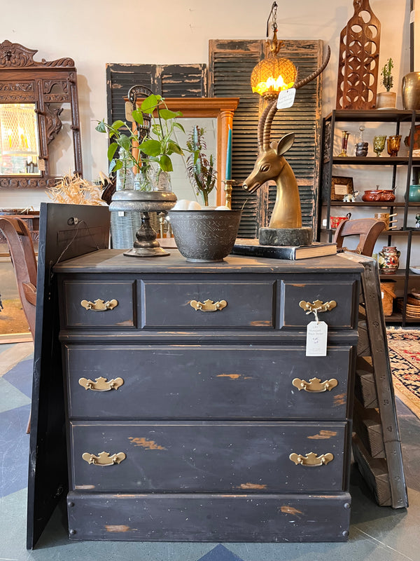 Staged distressed black dresser